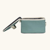 Side of an open Fluf GOTS organic cotton square lunch bag in a teal showing the black rinsable food inner lining 