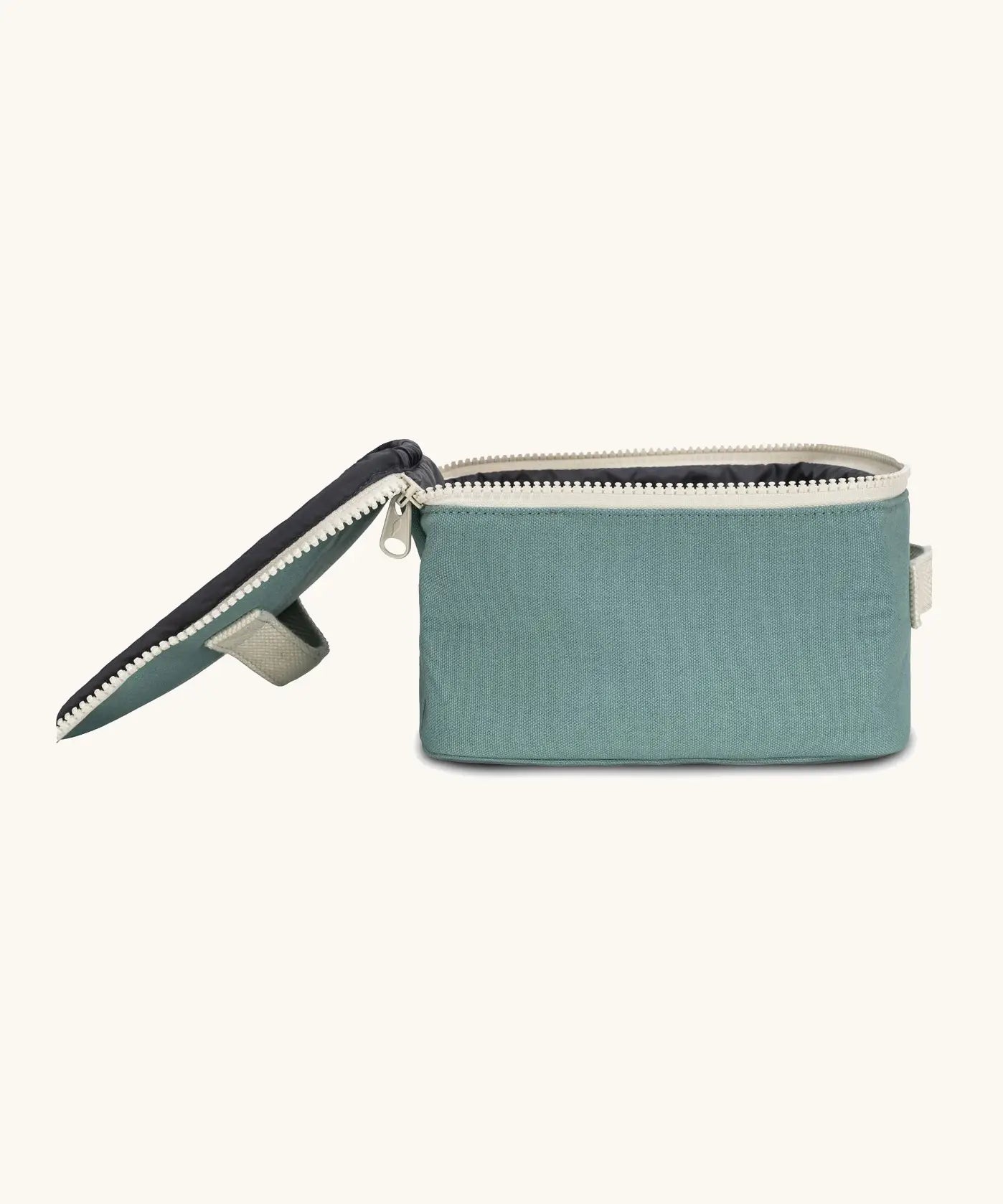 Side of an open Fluf GOTS organic cotton square lunch bag in a teal showing the black rinsable food inner lining 