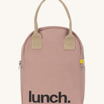 Fluf zip lunch bag in a pastel pink colour with a light brown handle and light brown zip detail on a cream background.