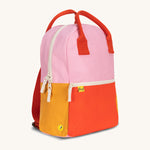 A side view of The organic cotton Fluf B-Pack Jr, a kids school backpack in a bright colour block design