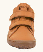 Front of the Froddo natural leather kids barefoot shoe in rusty brown showing the velcro straps and flexible sole. Shoe has a wide toe box and zero drop profile