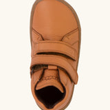 Top view of the Froddo natural leather kids barefoot shoe in rusty brown showing the velcro straps. Shoe has a wide toe box