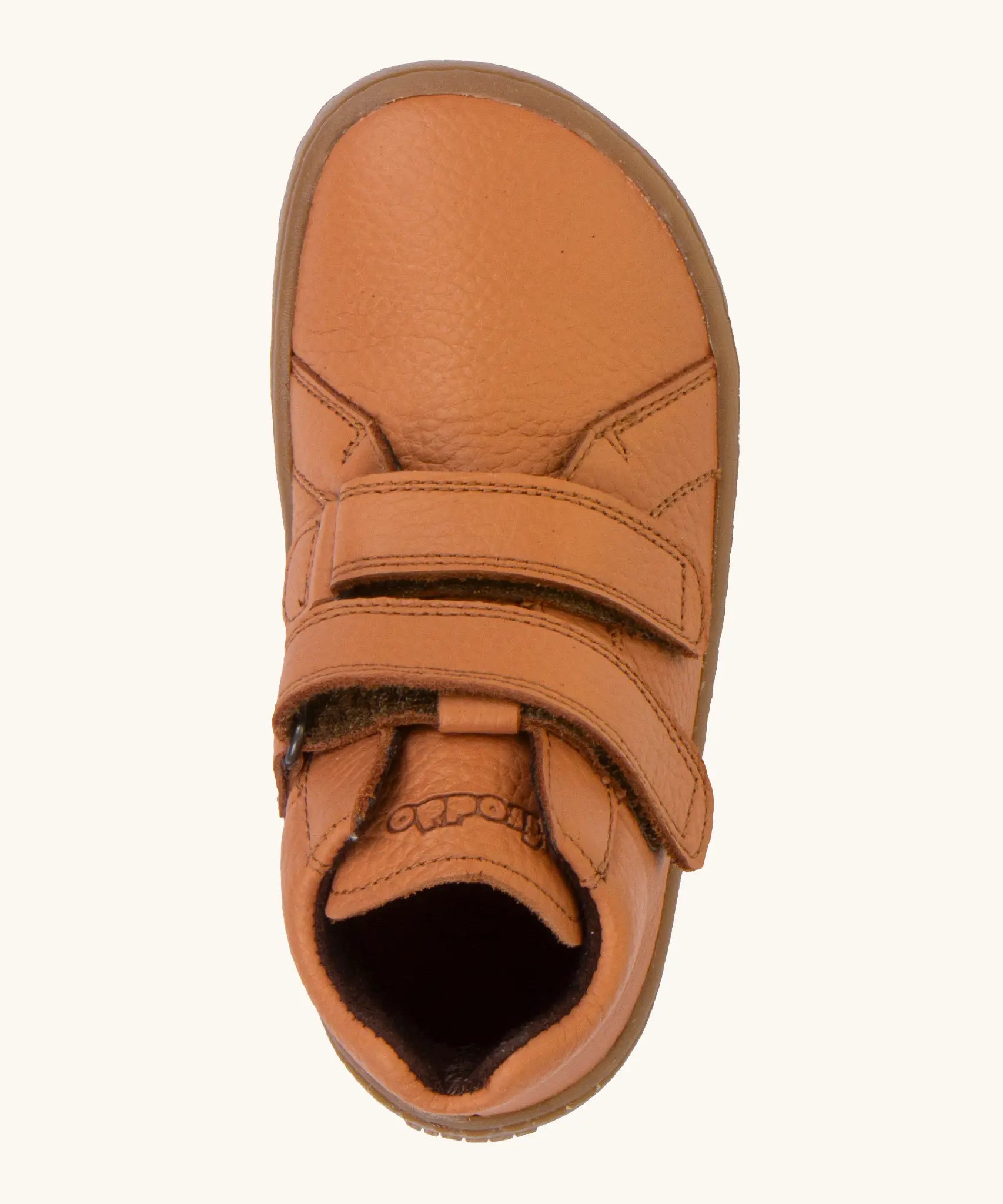 Top view of the Froddo natural leather kids barefoot shoe in rusty brown showing the velcro straps. Shoe has a wide toe box