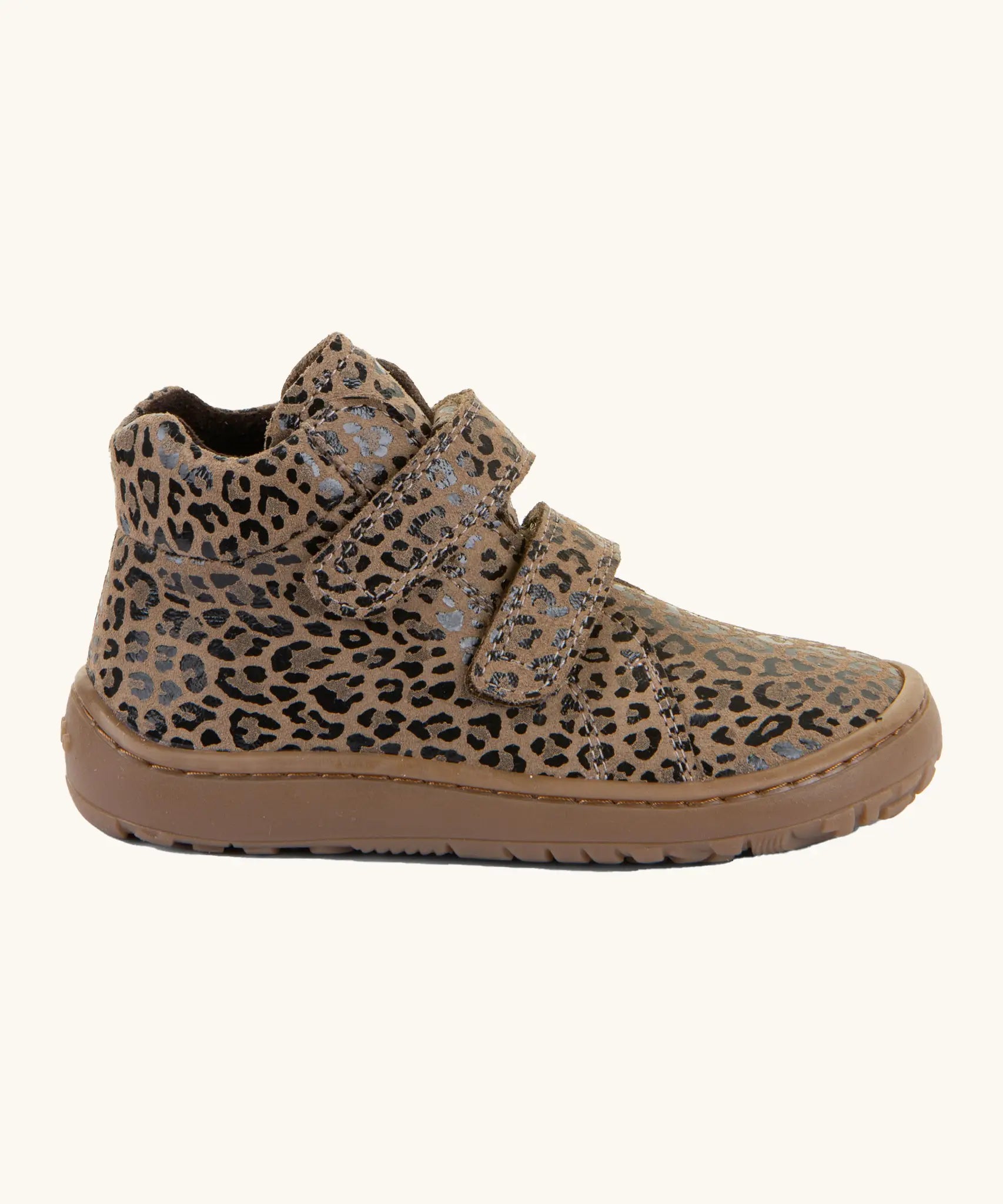 Side of Froddo's natural leather kids barefoot shoe in leopard print with a padded ankle support and flexible rubber sole. Shoe has a zero-drop profile