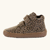 Side of Froddo natural leather kids barefoot shoe in leopard print showing the padded ankle support and velcro straps looped through the eyelets