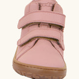 Front of the Froddo natural leather kids barefoot shoe in pink showing the velcro straps and flexible sole. Shoe has a wide toe box and zero drop profile
