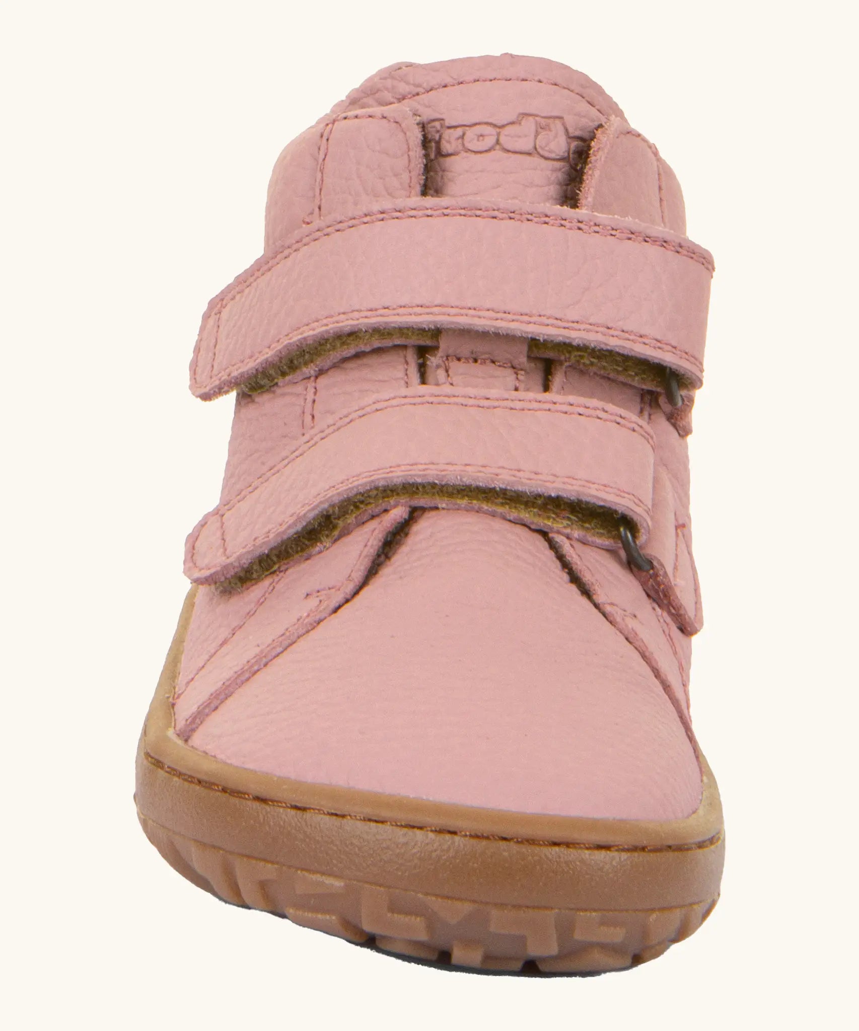 Front of the Froddo natural leather kids barefoot shoe in pink showing the velcro straps and flexible sole. Shoe has a wide toe box and zero drop profile