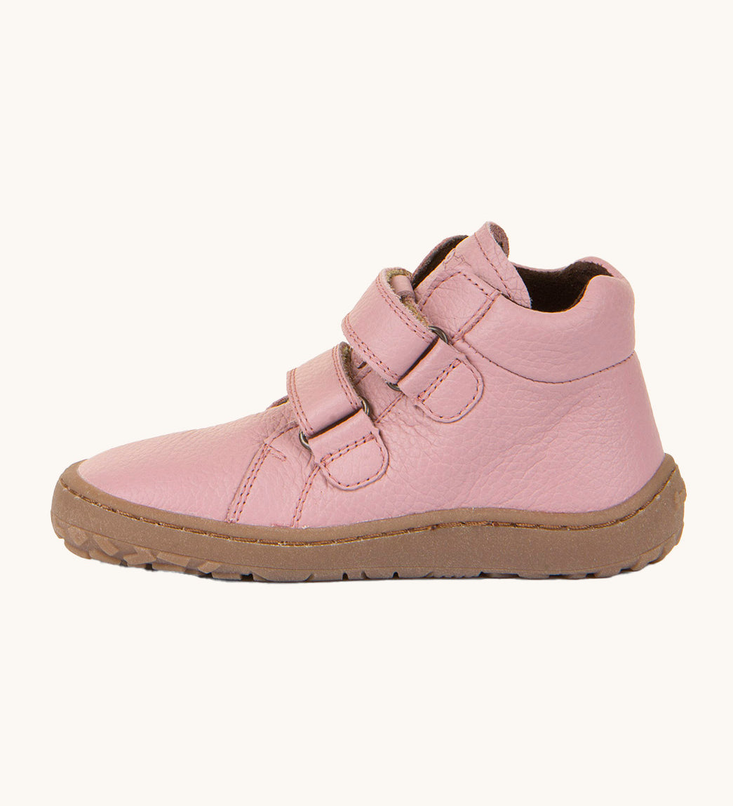 A side image of a Froddo barefoot Autumn children's shoe in pink available at Babipur showing the 2 velcro fastener for a secure fit, padded ankle and the dark brown grippy sole