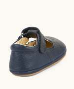 Back of Froddo barefoot pre walker baby shoe in dark blue. A natural leather shoe with a velcro t bar strap and padded ankle 