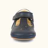 Froddo barefoot pre walker baby shoe in dark blue. A natural leather shoe with a velcro t bar strap and flower cut out pattern on front