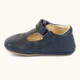 Side of Froddo barefoot pre walker baby shoe in dark blue. A natural leather shoe with a velcro t bar strap