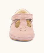 Front of Froddo barefoot walker baby shoe in pink. A natural leather shoe with a velcro t bar strap and flower cut out on toe