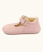 Side of Froddo barefoot walker baby shoe in pink. A natural leather shoe with a velcro t bar strap