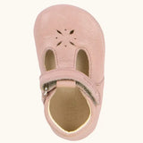 Froddo shoe in pink. A natural leather shoe with a velcro t bar strap and flower cut out on front
