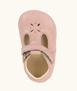 Froddo shoe in pink. A natural leather shoe with a velcro t bar strap and flower cut out on front