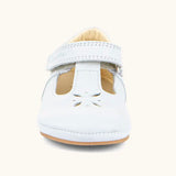 Froddo barefoot pre walker baby shoe in white. A natural leather shoe with a velcro t bar strap and flower cut out pattern on front