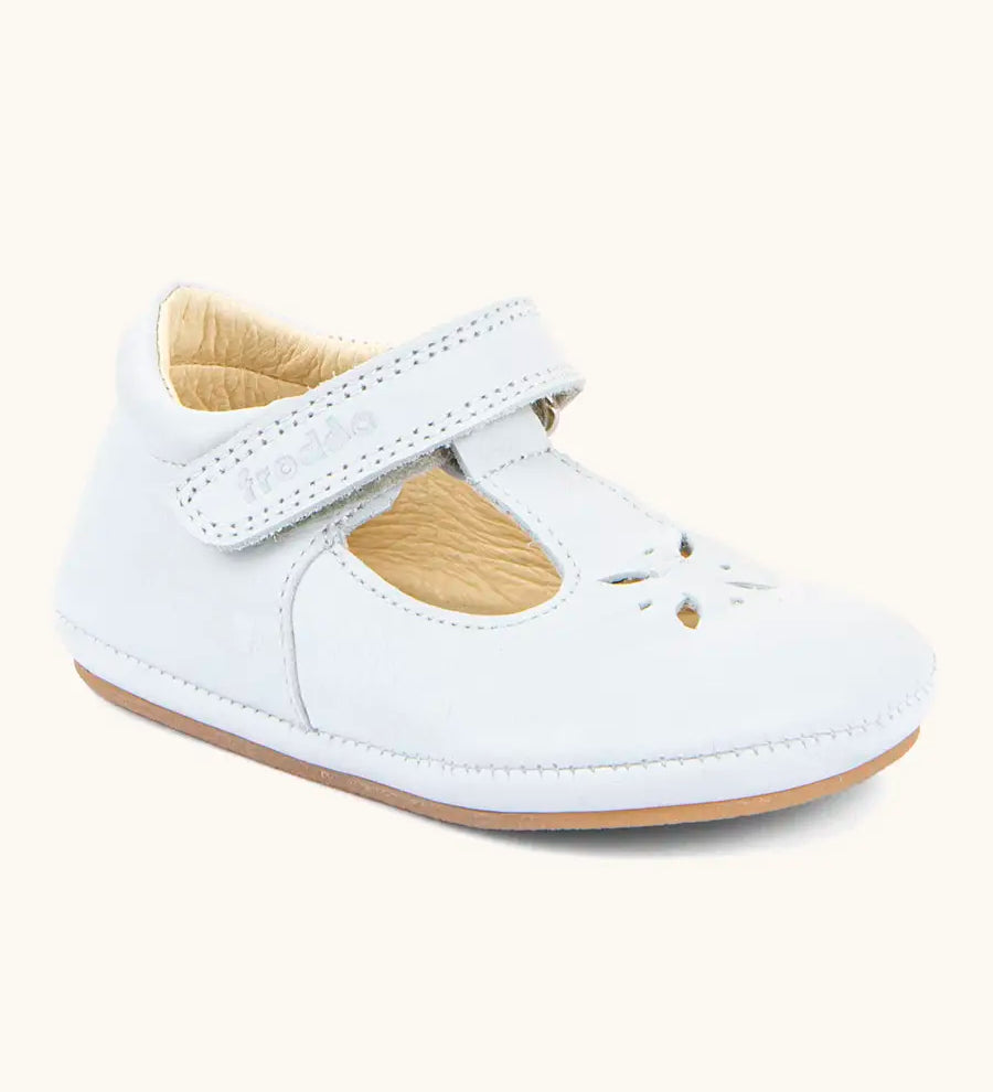Froddo barefoot pre walker baby shoe in white. A natural leather shoe with a velcro t bar strap
