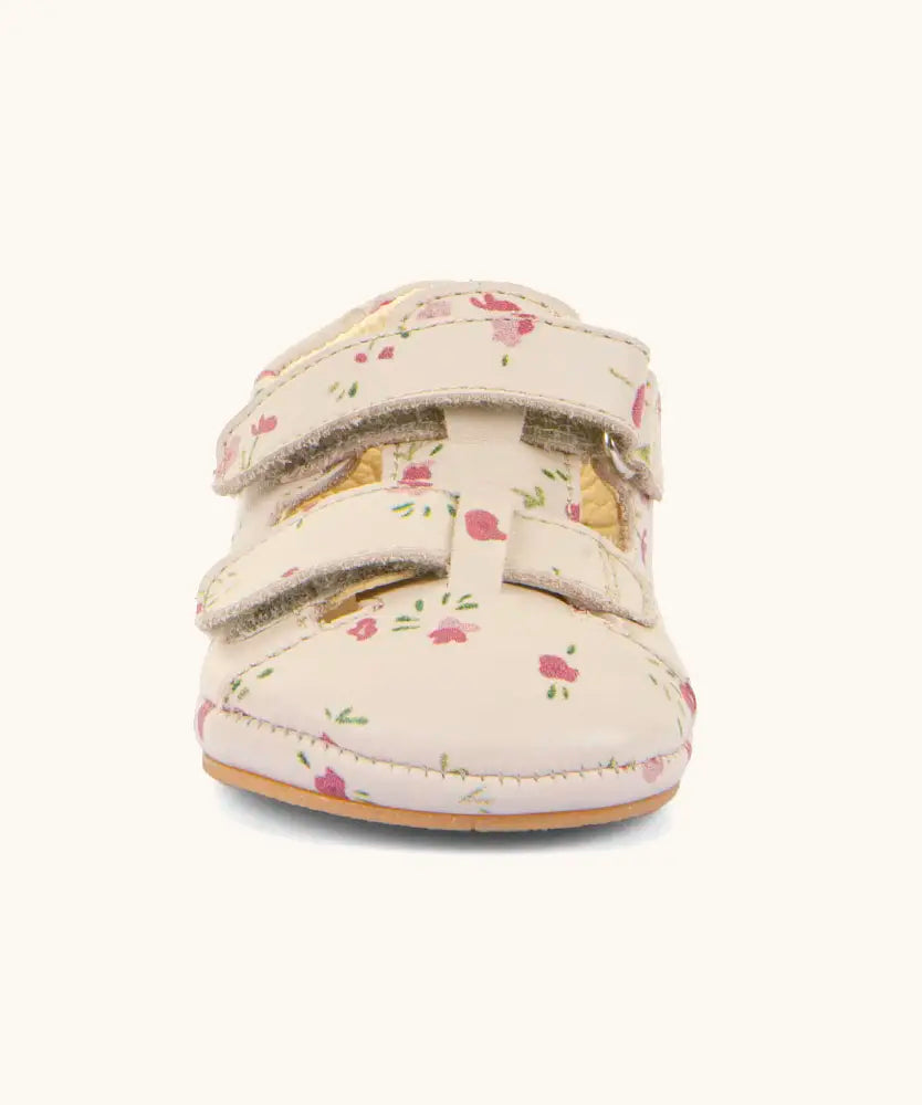 Froddo natural leather barefoot baby pre walker sandal shoe in pink with repeating flowers showing 2 front velcro straps fasteners