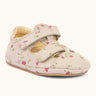 Froddo pink natural leather barefoot pre walker sandal shoe with a repeating floral patterns showing 2 front velcro straps and rubber sole