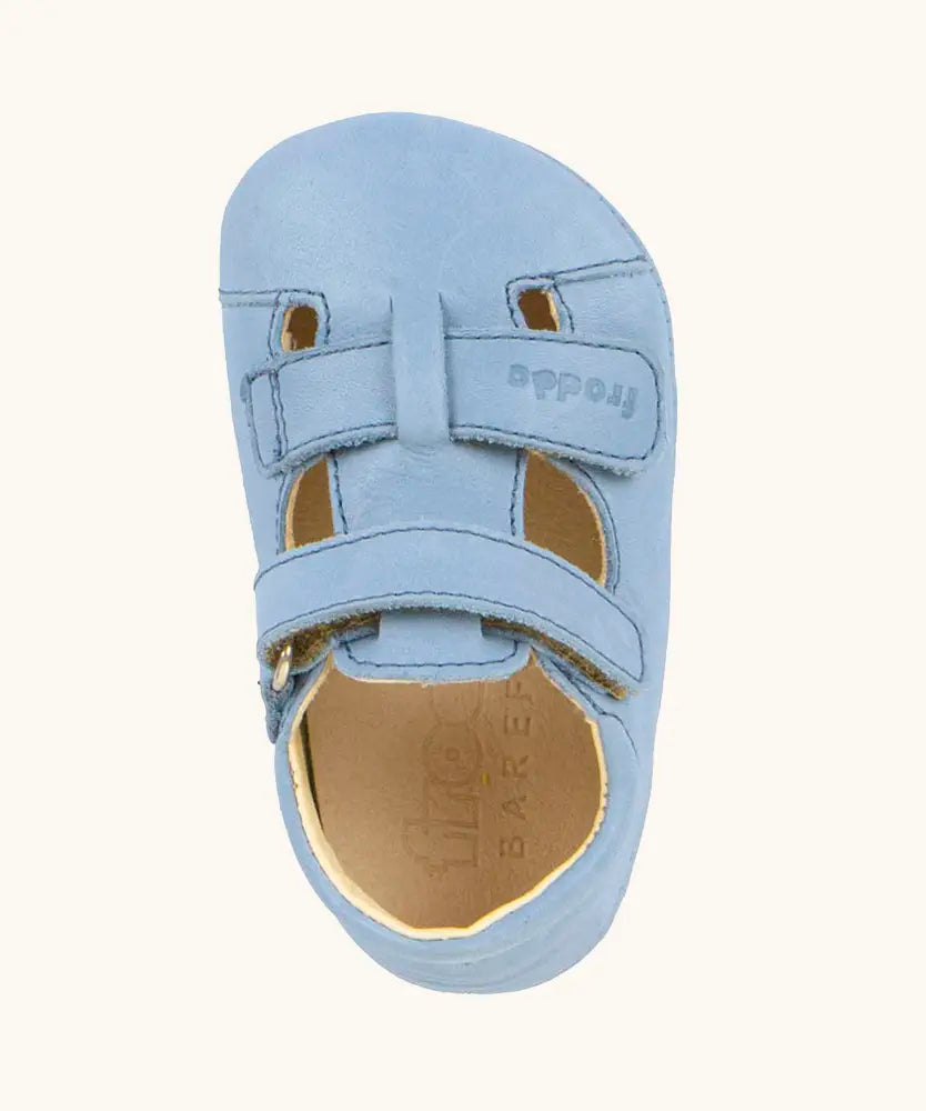 Top down view ofFroddo natural leather barefoot baby pre walker sandal shoe in light blue showing 2 front velcro straps 