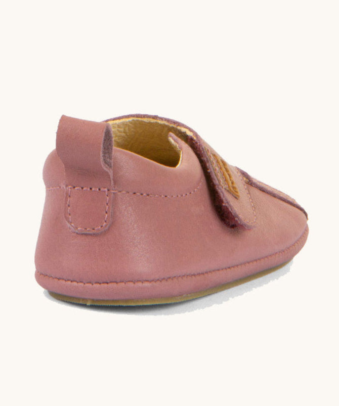 The back of the Froddo barefoot walker baby shoe in dark pink. Showing the pull tab and padded ankle support detail