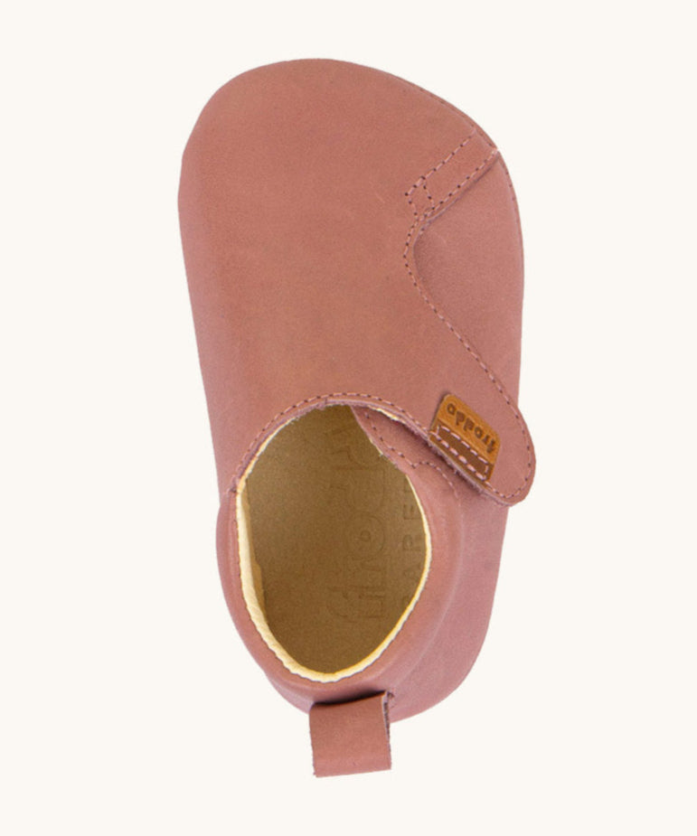 A top down image of the Froddo barefoot walker baby shoe in dark pink available at Baipur. Showing the velcro fastener detail