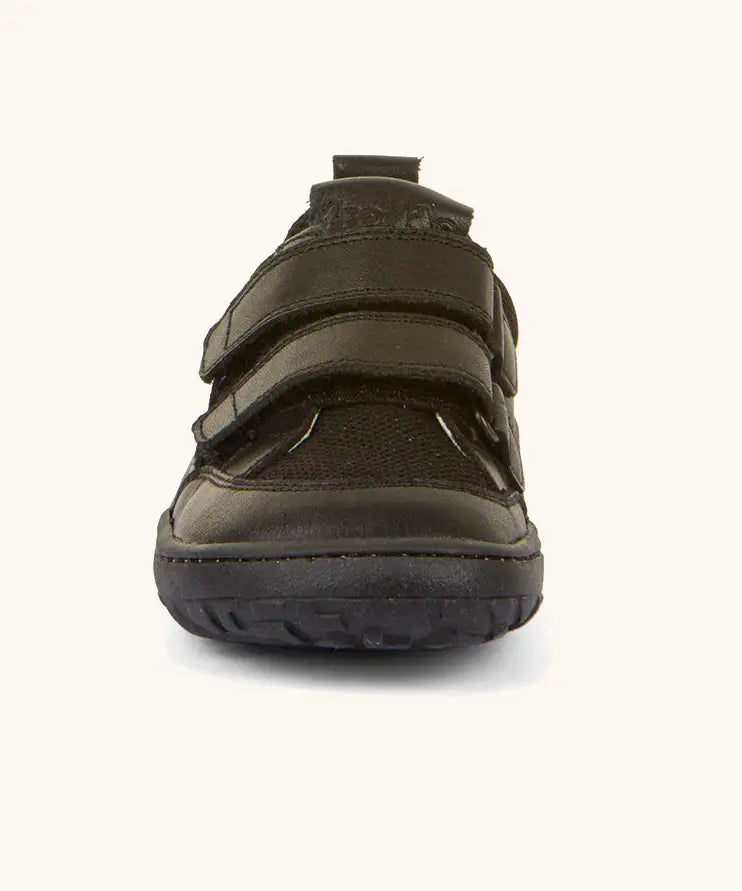 Front of the Froddo barefoot base children's shoe in black showing the 2 velcro fasteners and the black grippy sole