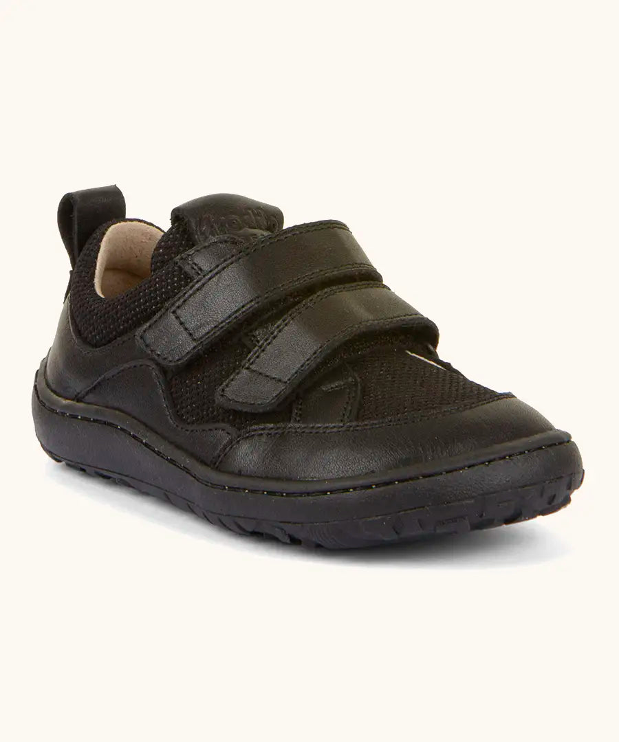 Froddo barefoot low profile children's shoe in black showing 2 velcro fasteners, pull tab on the back and a grippy sole