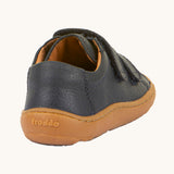 The back of the Froddo barefoot base children's shoe in navy available at Babipur. showing the padded ankle support and the brown grippy sole detail