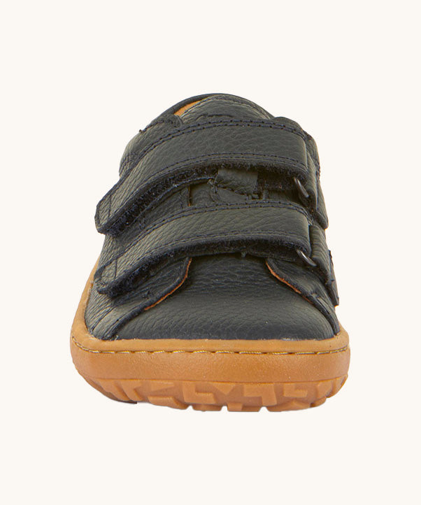 The front of the Froddo barefoot base children's shoe in navy available at Babipur. showing the 2 velcro fasteners and the brown grippy sole detail