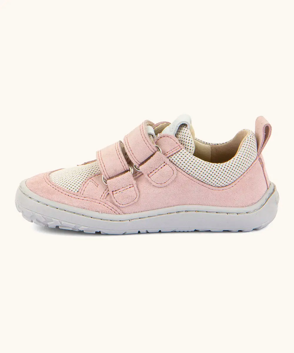 Side of Froddo barefoot base children's shoe in pale pink showing the 2 velcro fasteners looped through the eyelets