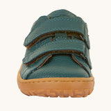 The front of the Froddo barefoot base children's shoe in petroleum available at Babipur. showing the 2 velcro fasteners and the brown grippy sole detail