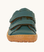The front of the Froddo barefoot base children's shoe in petroleum available at Babipur. showing the 2 velcro fasteners and the brown grippy sole detail