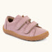 Froddo barefoot base children's shoe in pink. A natural leather low profile shoe showing 2 velcro fasteners and a grippy sole