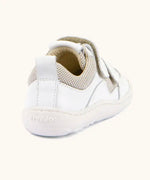 Back of Froddo barefoot low profile children's shoe in white showing  padded ankle support and pull tab