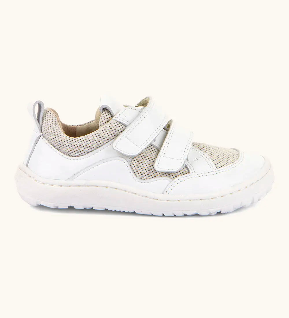 Froddo barefoot low profile children's shoe in white showing 2 velcro fasteners, pull tab on the back and a grippy sole