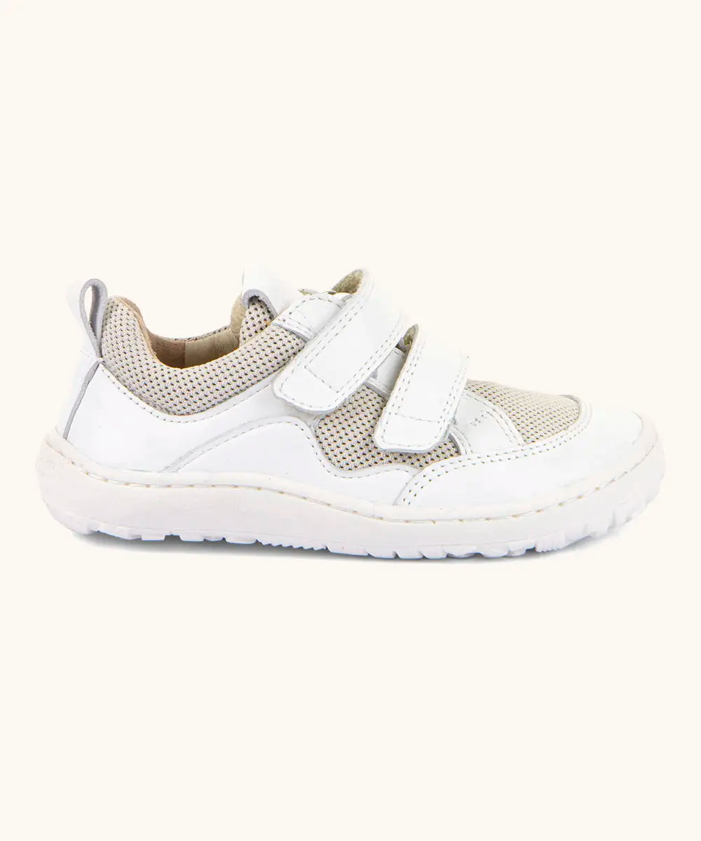 Froddo barefoot low profile children's shoe in white showing 2 velcro fasteners, pull tab on the back and a grippy sole