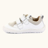 Side of Froddo barefoot low profile children's shoe in white showing 2 velcro fasteners looped through eyelets