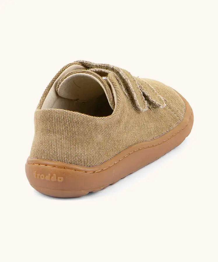 Back of Froddo barefoot botaniq kids canvas stye shoes in beige with a brown rubber grippy sole 