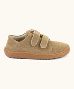 Side of Froddo barefoot botaniq kids canvas stye shoes in beige shows velcro straps a brown grippy sole