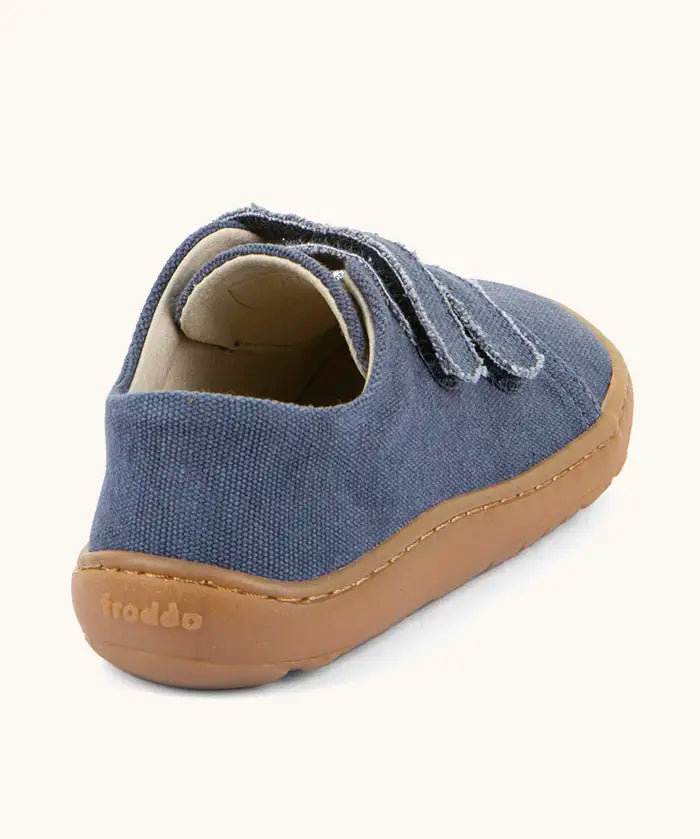 Back of Froddo barefoot botaniq kids canvas stye shoes in blue with a brown rubber grippy sole 