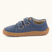 Froddo barefoot botaniq kids canvas stye shoes in blue shows velcro straps looped through the eyelets and a brown grippy sole