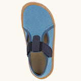 Top view of Froddo barefoot canvas style kids shoes in light blue with  showing contrast t-bar velcro looped through the eyelet 