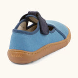 Back of Froddo barefoot canvas style kids shoes in light blue with a contrast t-bar velcro fastener and brown rubber sole