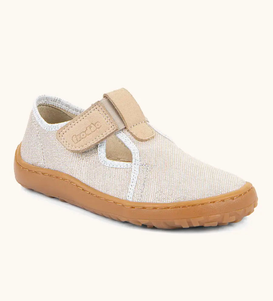 Froddo barefoot canvas style kids shoes in pale cream with a t-bar velcro fastener and brown rubber sole