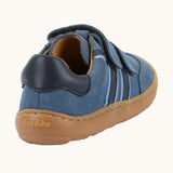 Back of Froddo barefoot f-motion kids suede shoes in denim blue with contrasting light side stripes design, flexible rubber sole. Trainer has a zero heel drop