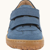 Front of Froddo barefoot f-motion kids suede shoes in denim blue with 2 velcro fasteners, flexible rubber sole. Trainer has wide foot-shaped toe box