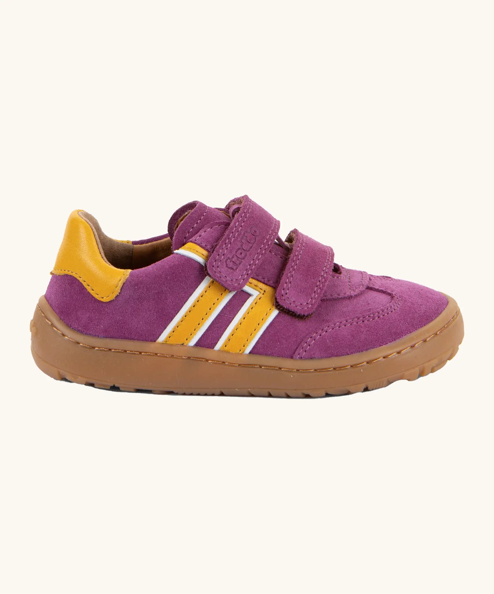 Side of Froddo's barefoot f-motion kids suede shoes in purple with yellow side stripes, 2 velcro fasteners, flexible rubber sole. Trainer has a zero heel drop