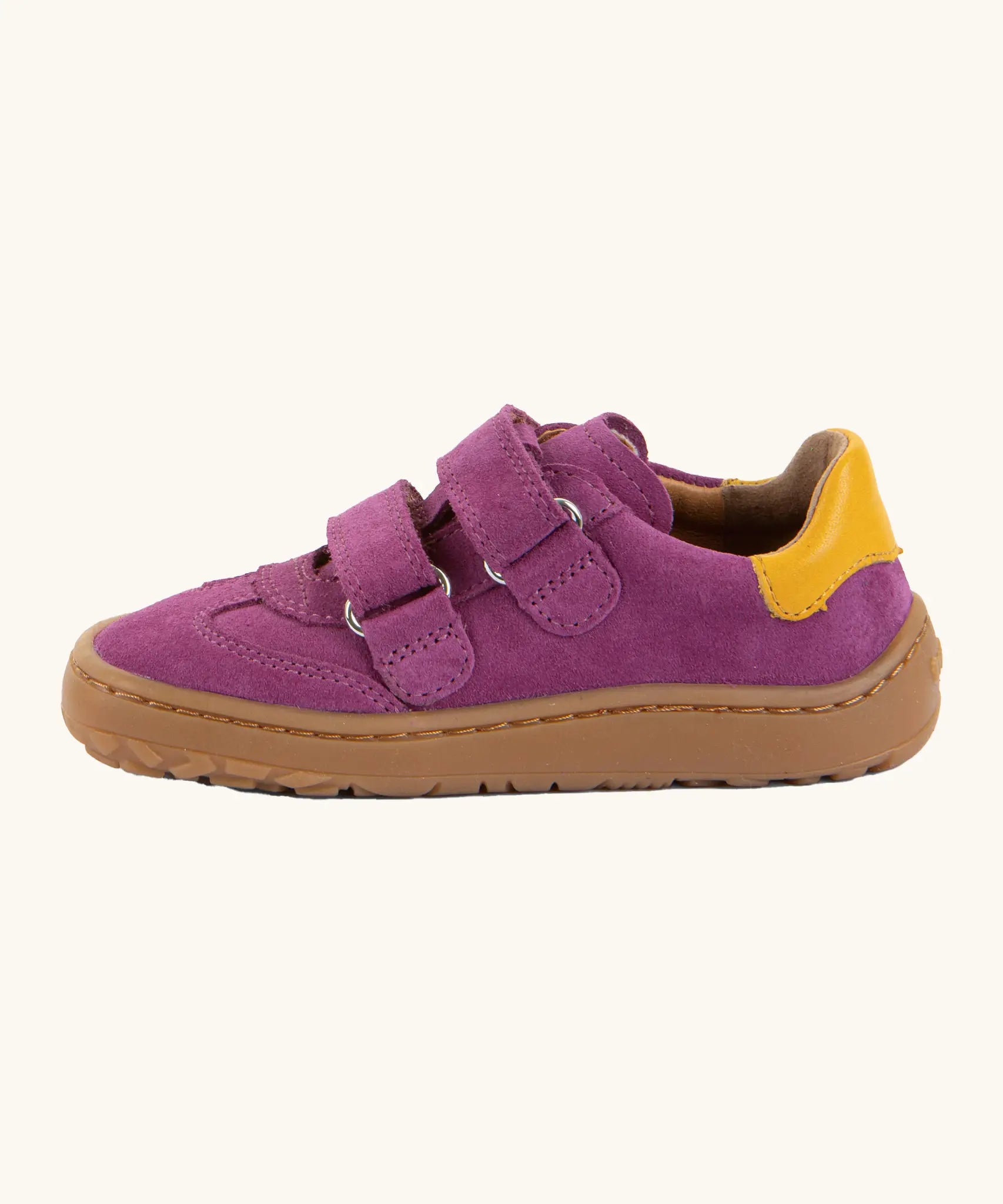 Side of Froddo's barefoot f-motion kids suede shoes in purple showing the velcro fasteners looped through the eyelets and yellow heel tab