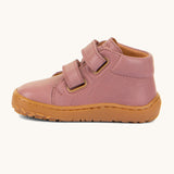 A side image of the Froddo barefoot first step kids shoes in dusty pink available at Babipur showing the 2 velcro strap fasteners looped through and the light brown grippy sole detail